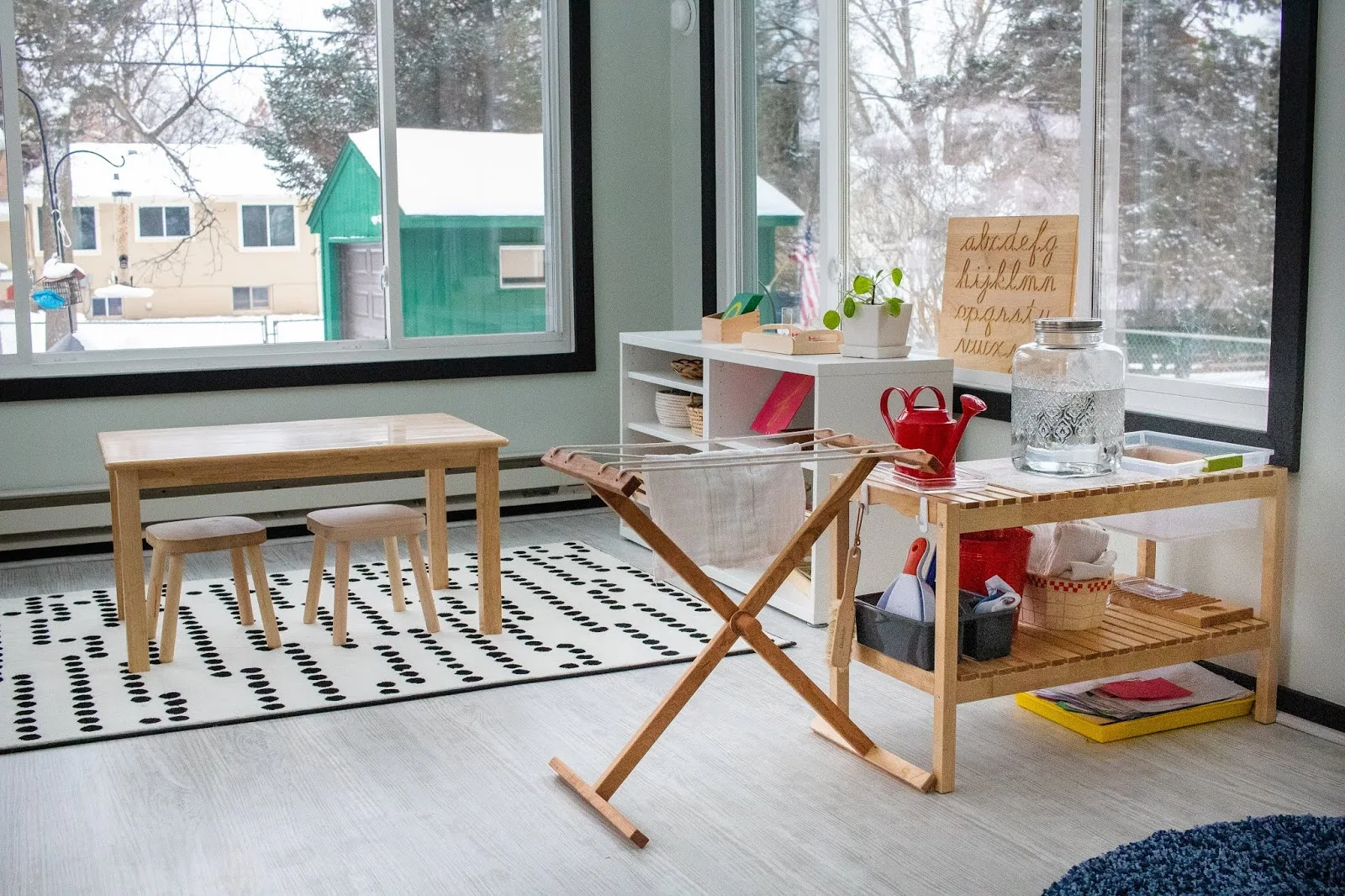 A look at our multi-use, multi-age Montessori playroom, including art area and Montessori baby space.