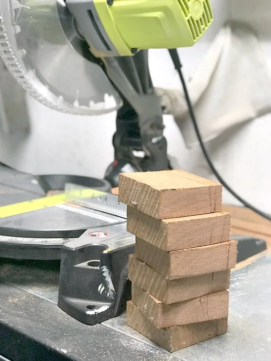 Chop saw cutting the board into smaller pieces