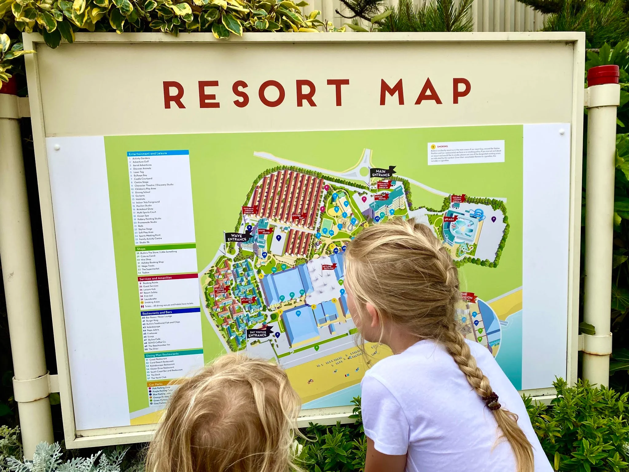 two children looking at the Butlins Bognor Regis Resort Map showing where all the different accomodation is