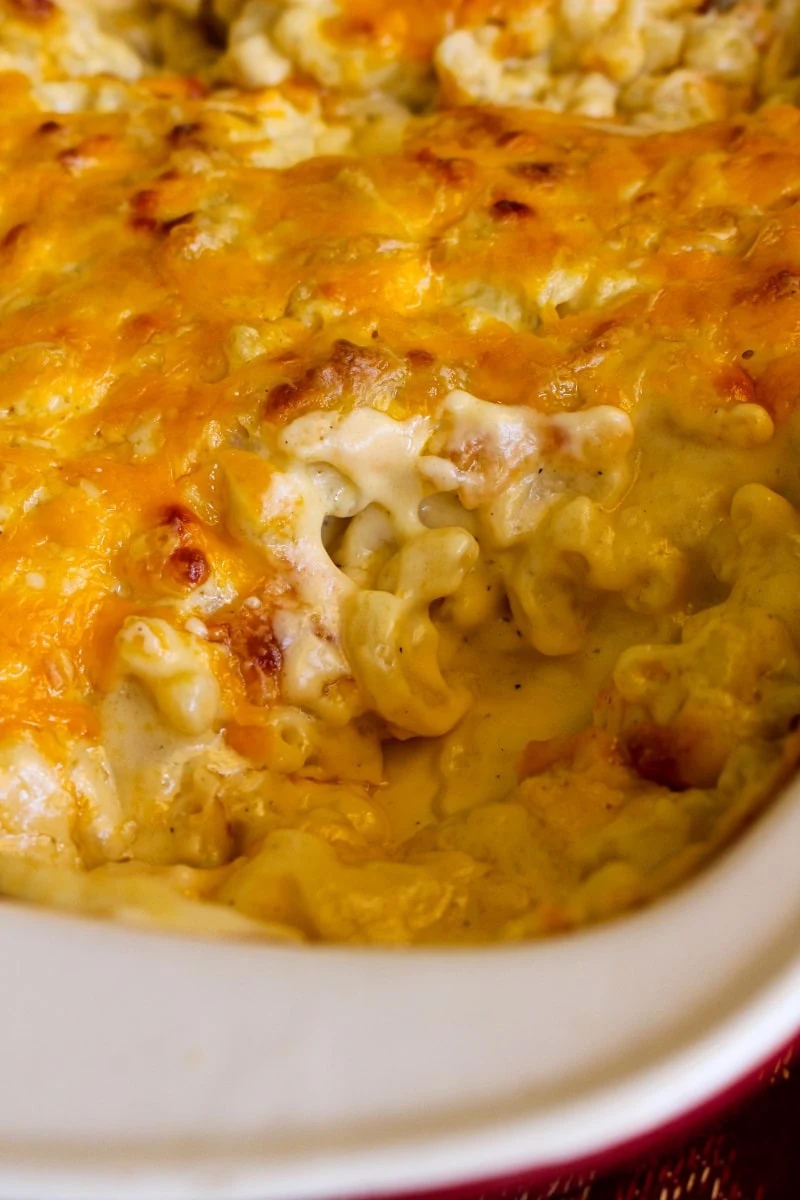 This Extra Creamy Baked Macaroni and Cheese recipe is made with an irresistibly rich and silky cheddar cheese sauce. It is the creamiest, cheesiest baked mac and cheese ever!