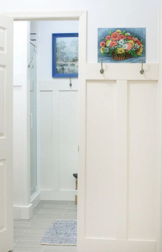 small entry with hooks and colorful art