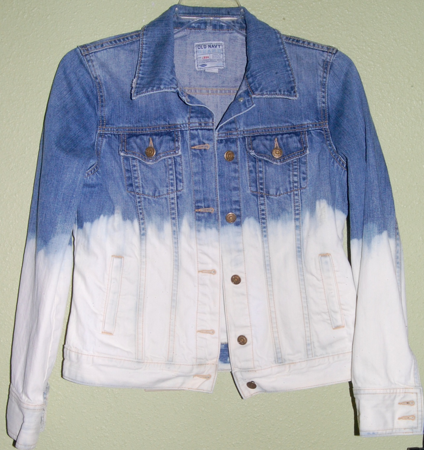 Kerencia DIY studded ombre bleached denim jacket.