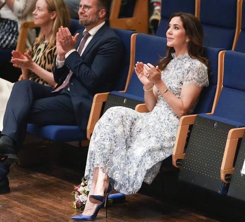 Crown Princess Mary wore a lace floral elodie dress from Moss & Spy, and  silk pumps from Gianvito Rossi. Prada satin clutch