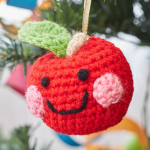 http://www.redheart.com/files/patterns/pdf/LW5750-Cheeky-Apple-Ornament-Free-Crochet-Pattern.pdf