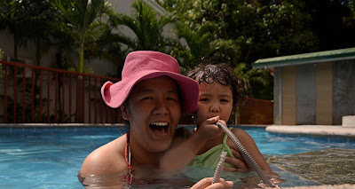 Mama and Kecil at the swimming pool