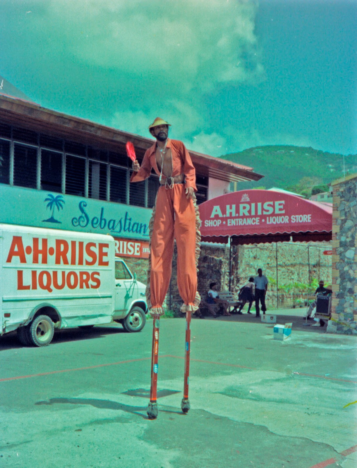 Man on Stilts Sign