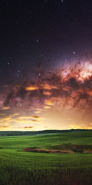 Galaxy HD wallpaper over green field Galaxy HD wallpaper over green field