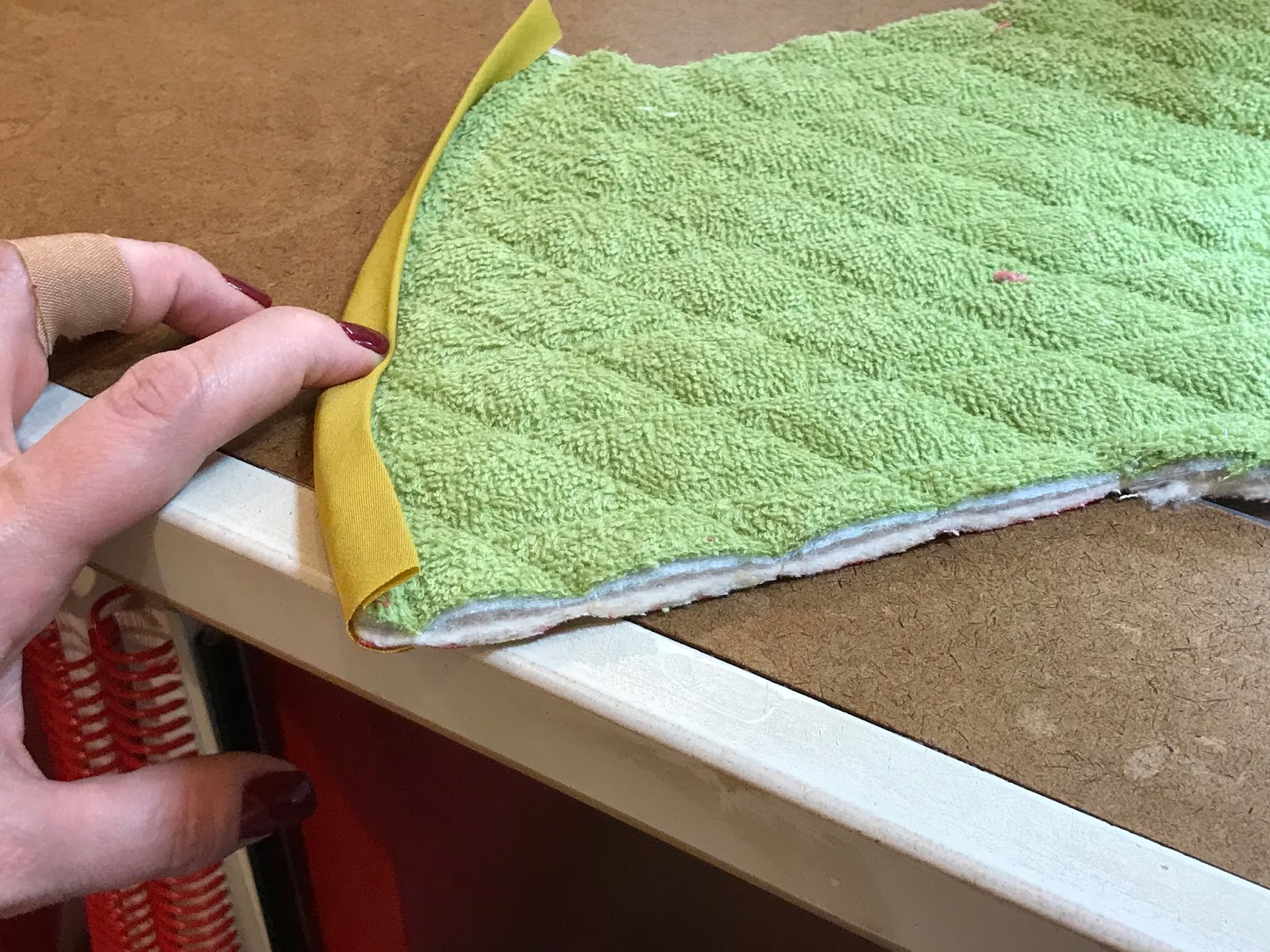 People using twill tape to finish the back of your rugs - What adhesive are  you using? I've been using regular hot glue but I'm worried about the  longevity of it. 