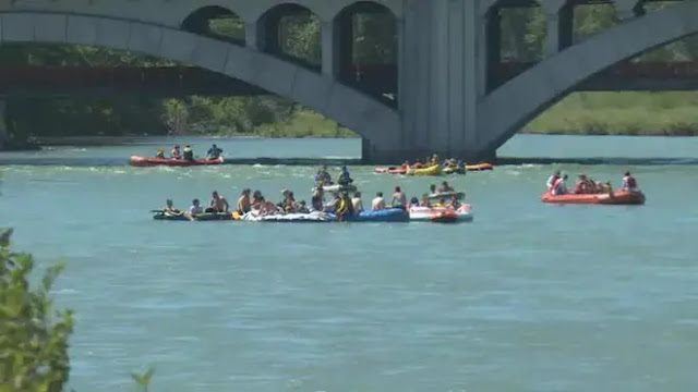 People cool off on the Bow River in Alberta, Canada. Photo: CBC