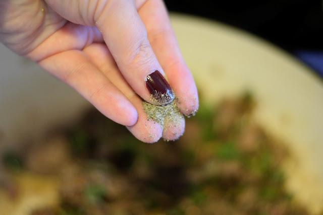 Pepper being added to the pan. 