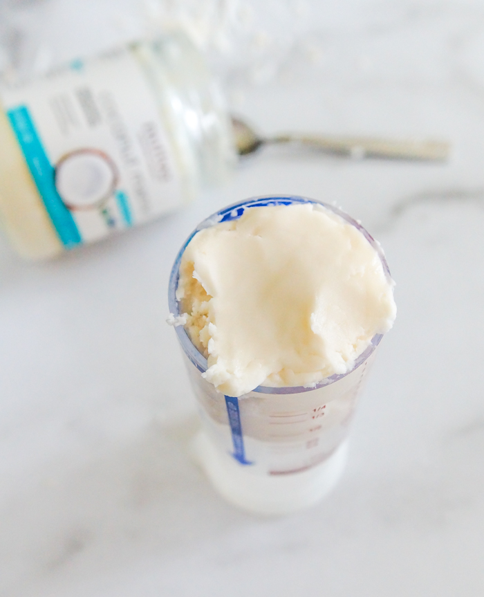 coconut butter in measuring cup