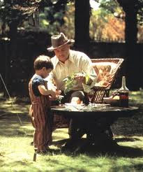 Marlon Brando as The Godfather playing with his grandson movieloversreviews.filminspector.com