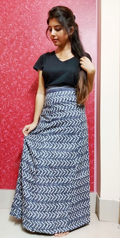 Ritu Biswas wearing black t-shirt with wrapper skirt in her fashion and lifestyle blog. Ritu Biswas wearing black t-shirt with wrapper skirt in her fashion and lifestyle blog.