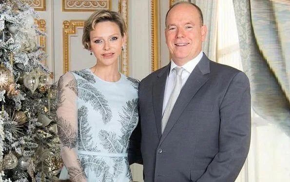 Princess Charlene wore a blue silk and embellished gown from Ralph & Russo. Ralph and Russo gunmetal feather embellished dress. Princess Gabriella