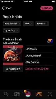 Screenshot from Libby app, library audio material app, showing The Mars Strain audiobook is now available.