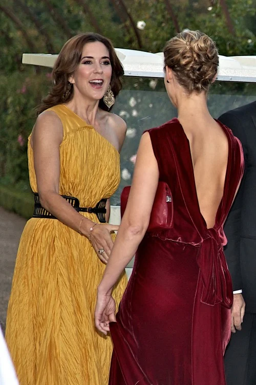 Danish royals stepped out in elegant colourful garbs, Crown Princess Mary looked radiant in a long asymmetrical warm yellow dress
