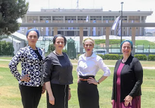 The Ambash wives posing in front of the Knesset