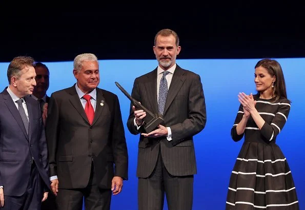 Queen Letizia wore a new flare striped cocktail dress by Carolina Herrera