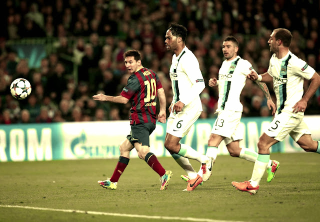 Messi scoring against Manchester City