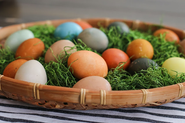 earthy toned naturally dyed Easter eggs in a boho basket