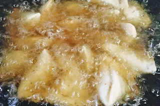 Deep frying the samosa for Samosa recipe