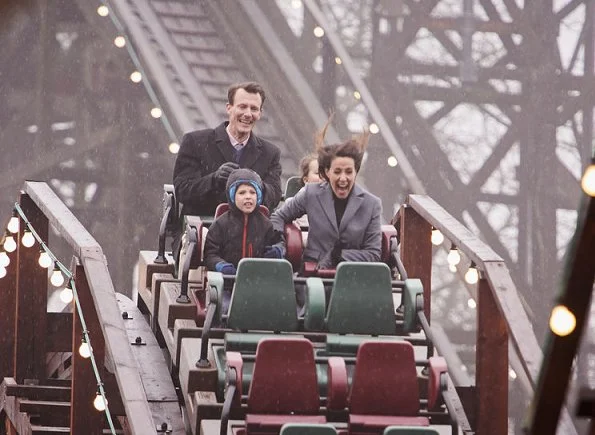 Prince Joachim, Princess Marie and their children Princess Athena and Prince Henrik attend opening of the Bakken amusement park in Klampenborg. Princess Marie wore Ralph Lauren wool coat