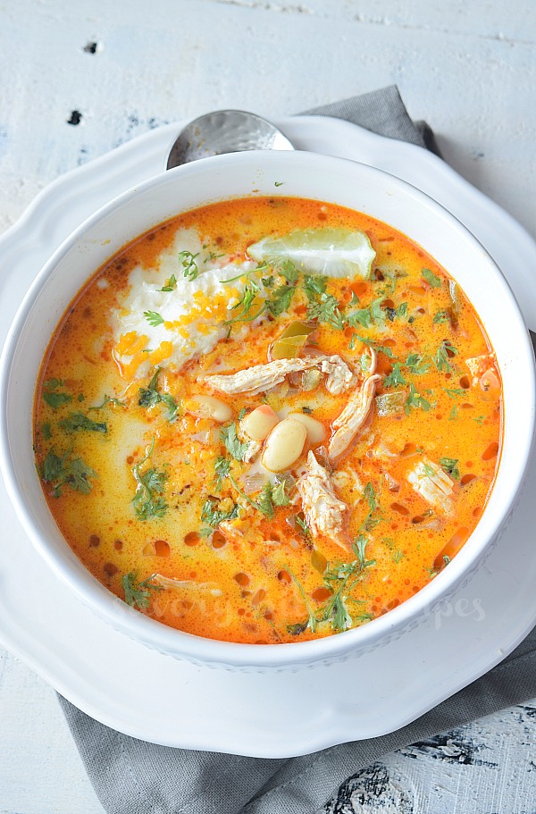 birdseyeview of a white plate and white bowl with white chicken chili