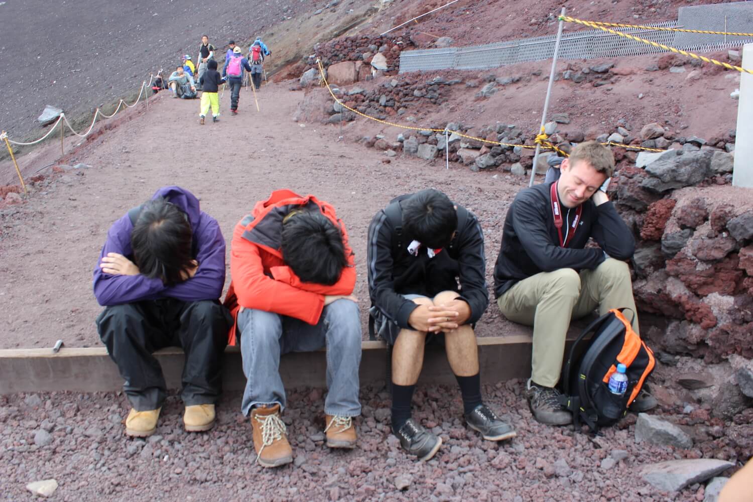 mt fuji crater behind the group