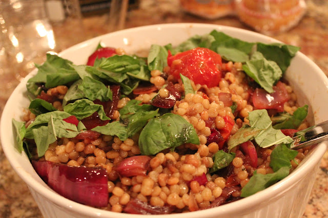 Fregola with charred onions and roasted cocktail tomatoes