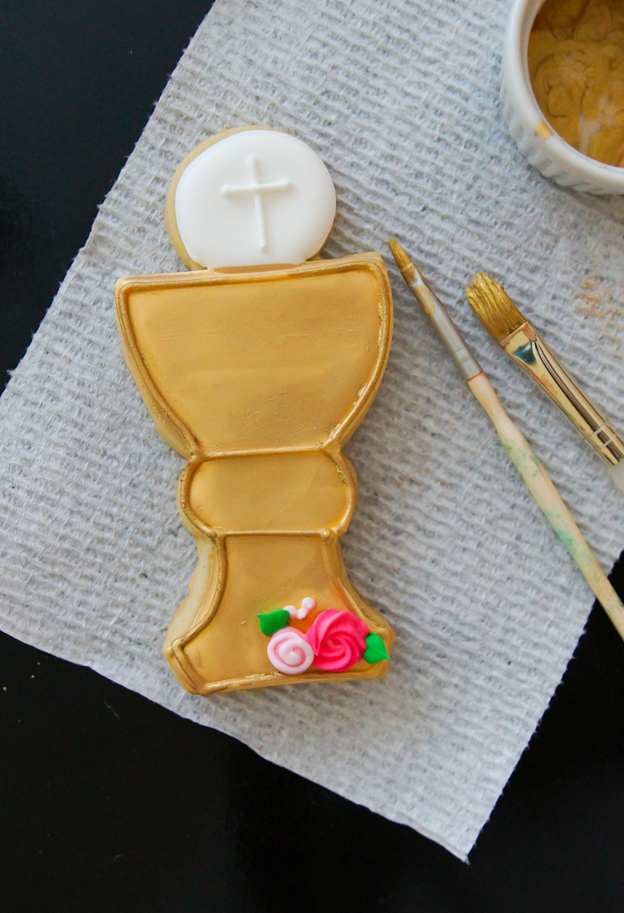 First Communion Cookies for a Girl, applying luster dust to a chalice cookie