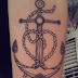 Anchor tattoo and heart tattoo on leg