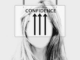 on the forehead of a woman written "Confidence"