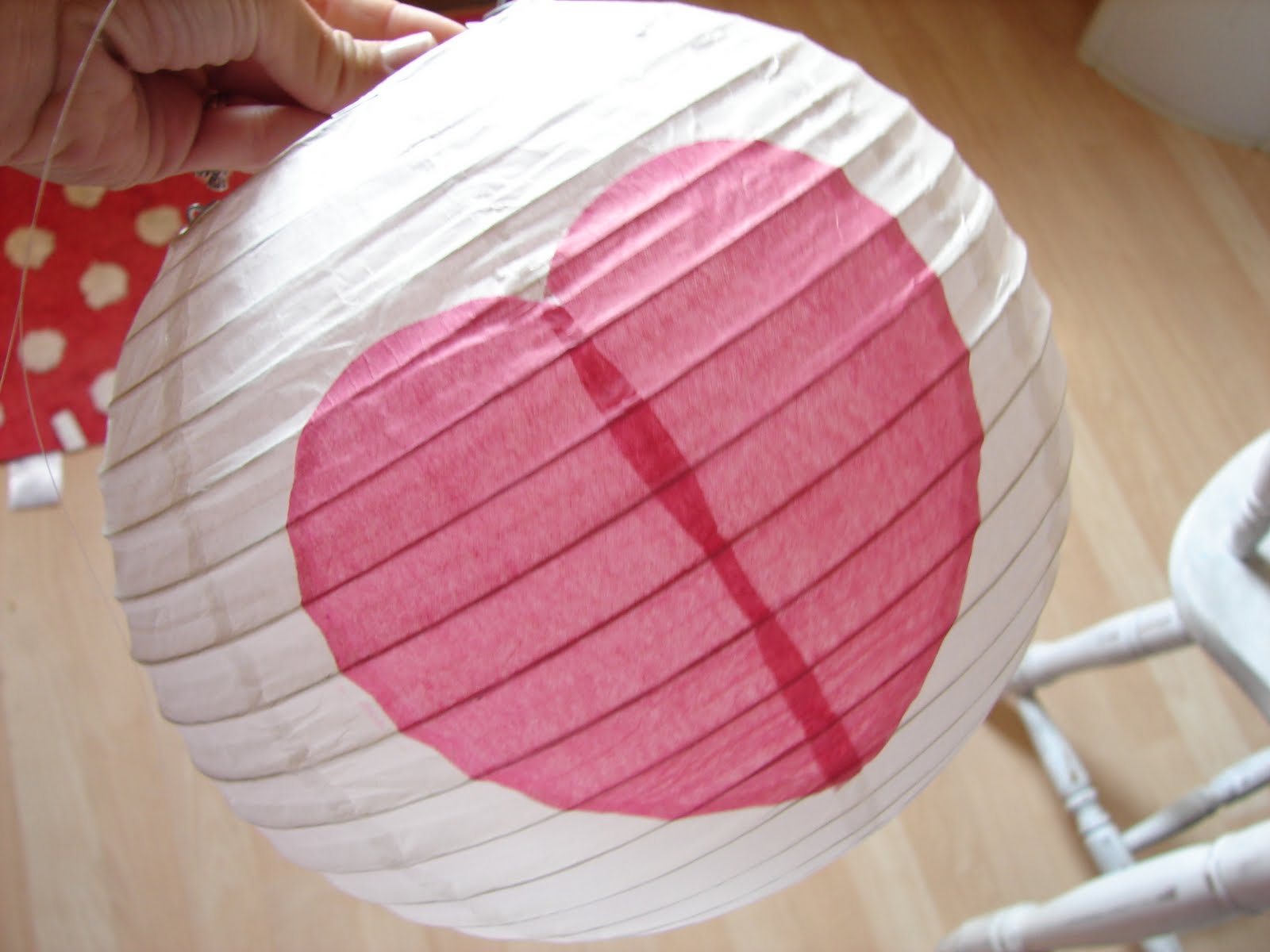 paper lanterns. A girl and a glue gun