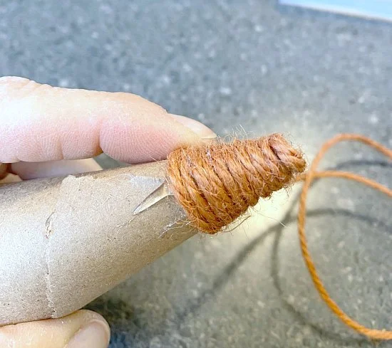 Wrapping jute around the cone beginning at the tip