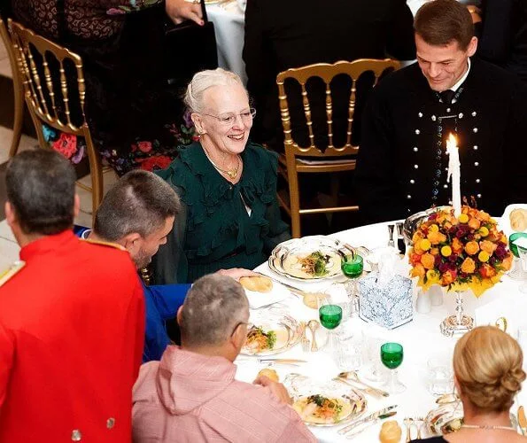 Crown Prince Frederik and Crown Princess Mary, hosted a concert a dinner in the Dome Hall. red skirt and blouse