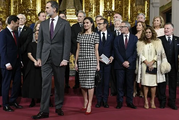 Queen Letizia wore Hugo Boss Clady houndstooth top and Riami houndstooth pencil skirt. Boss Catifa wool cashmere shawl collar coat