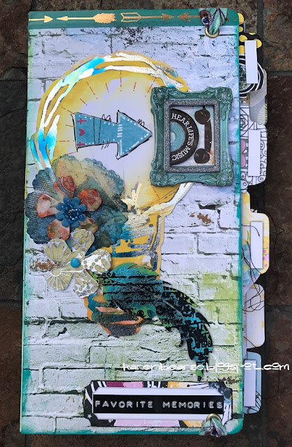 Life In Color Eileen Hull Journal cover of journal light bulb with decofoil, resin flowers & a feather