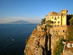 A clifftop hotel in Sant'Agnello with Vesuvius in the  background, across of the Gulf of Naples