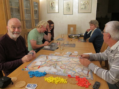 Ticket To Ride: Europe - Crispin spots I have the camera and Daniella doesn't look happy at how the other game is going