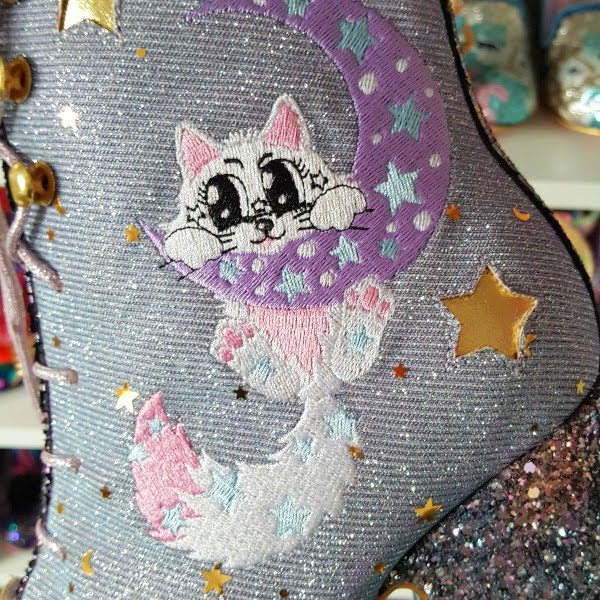 close up of cat on moon embroidery on side of ankle boot