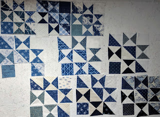 Blue and white blocks laid out on the design wall