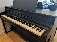 Roland HP704 digital piano