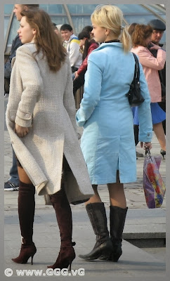 Women in black boots on the street