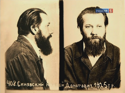Yellowed police-type photo collage of the same bearded man in profile (left) and from the front (right).