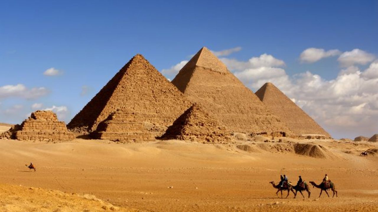  The image shows the Giza pyramid complex in Egypt, which was built as a tomb for the pharaohs Khufu, Khafre, and Menkaure.