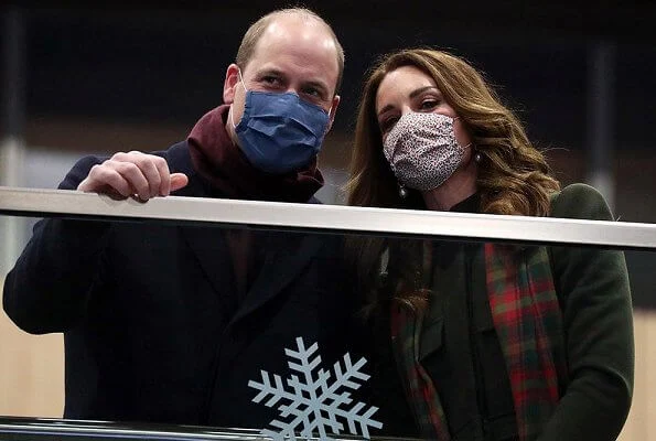 Kate Middleton wore a khaki coat and tartan scarf from Alexander McQueen, and blue coat and black gloves from Catherine Walker. Meghan Markle