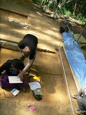 Archaeologist J. O'Hara supervising a student in 2014