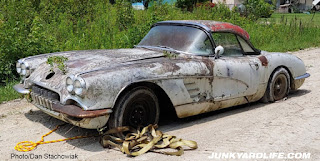 Yellow tow strap pulled the Vette out of field.