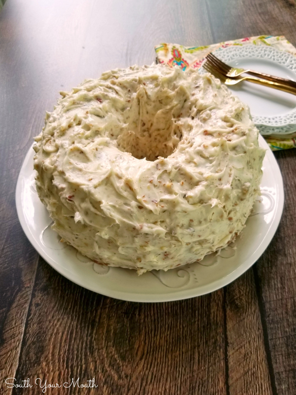 A decadent Southern pound cake recipe made with sour cream and pecans topped with an ultra creamy pecan-studded cream cheese frosting that will have folks begging for the recipe!