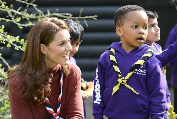 Kate Middleton is wearing her J Crew Mockneck sweater and Chloe boots